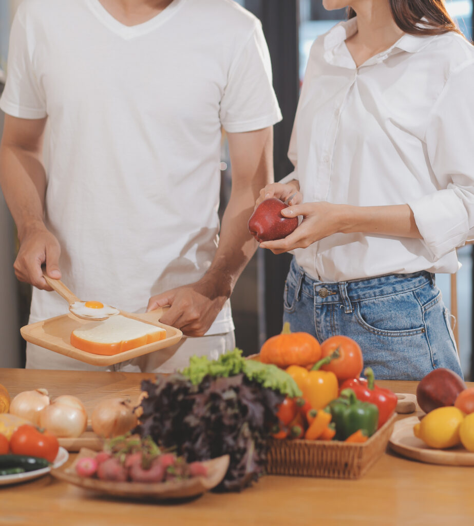 handsome-man-sitting-near-his-wife-kitchen-family-couple-see-social-media-surf-web-while-sitting-kitchen-table-with-generic-laptop-couple-working-with-laptop-home