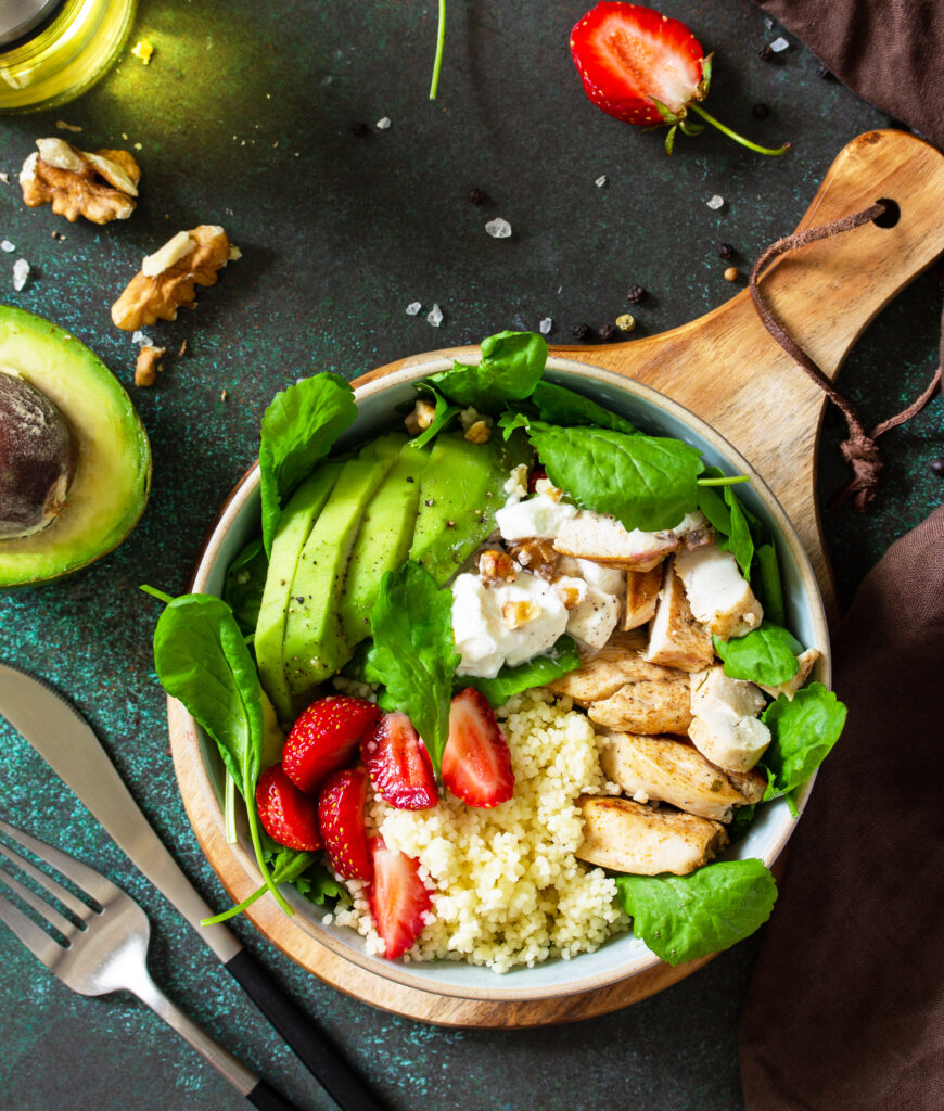 healthy-food-diet-lunch-menu-couscous-salad-with-strawberries-grilled-chicken-top-view-flat-lay